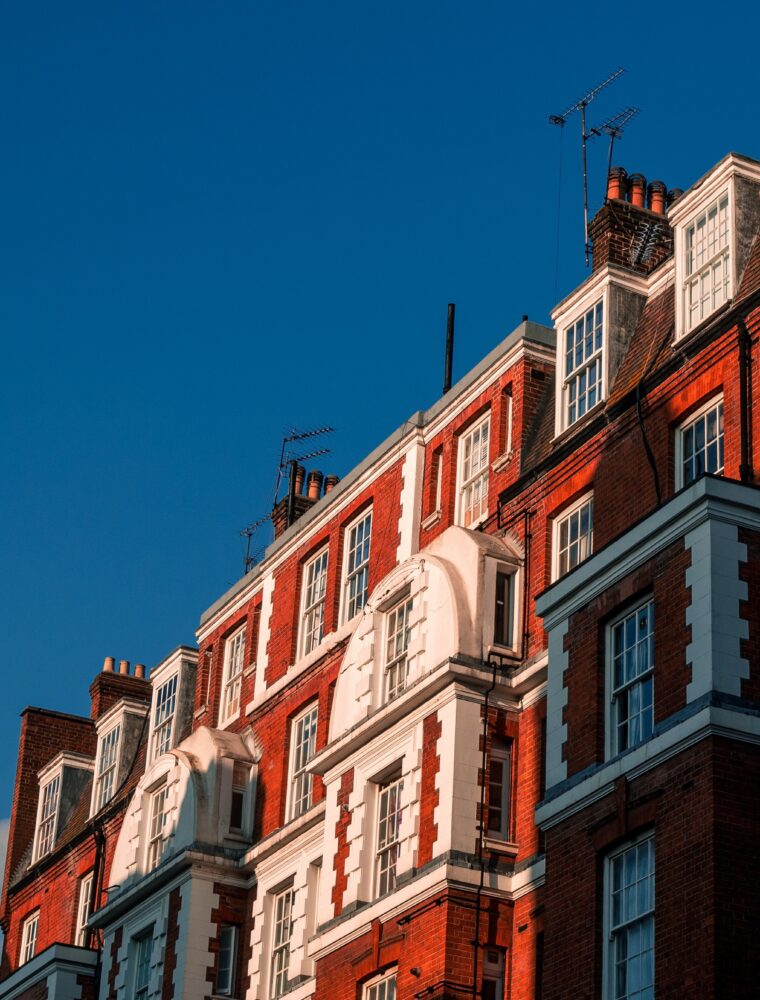 A large apartment building in London, built using red and white bricks