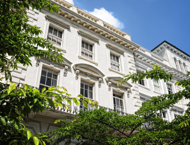 A large white building in London with trees in front