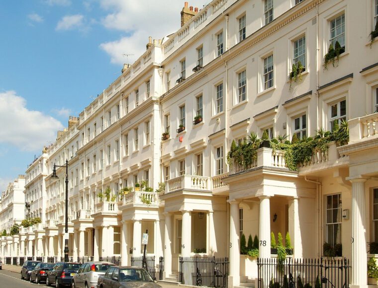 A street in London lined by large white stucco fronted heritage buildings