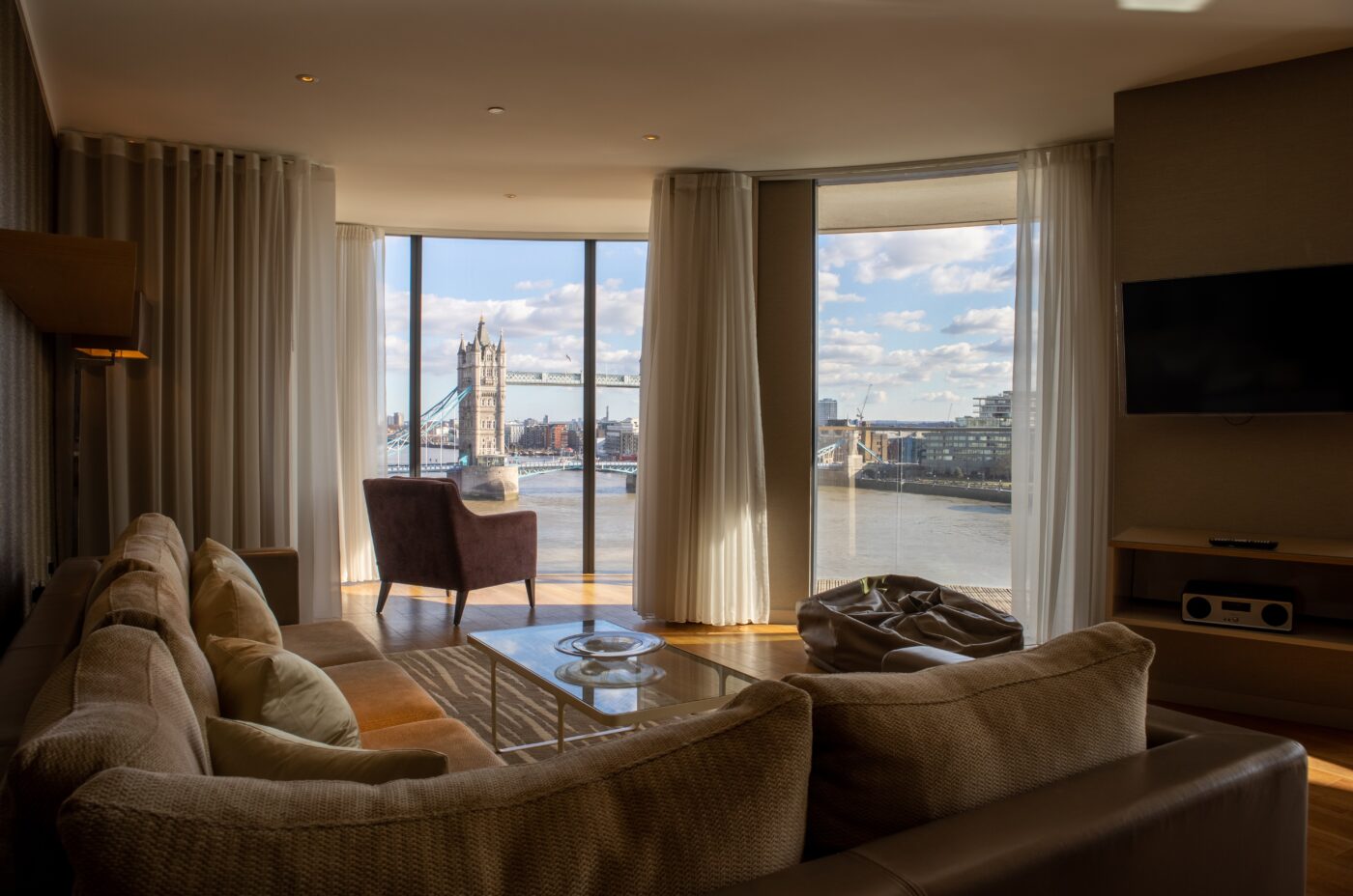 View of London bridge from a penthouse apartment. A London buying agent can help you find the right property.